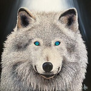 White wolf with striking blue eyes.