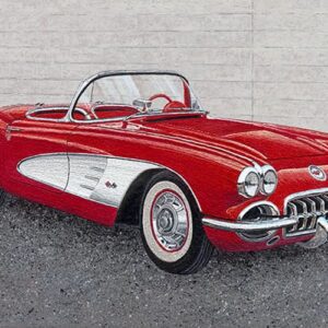 Red vintage convertible car on display.
