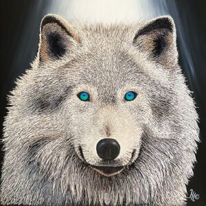 White wolf with striking blue eyes.